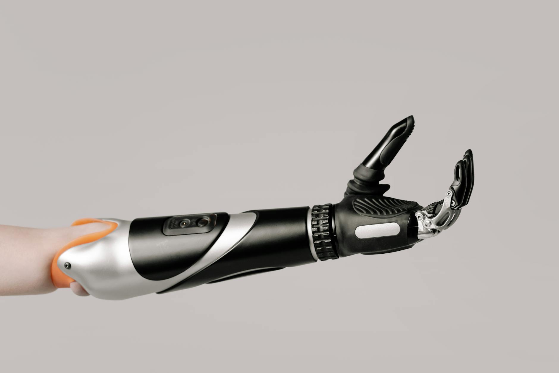 Close-up of a modern prosthetic arm displaying advanced technology and design.